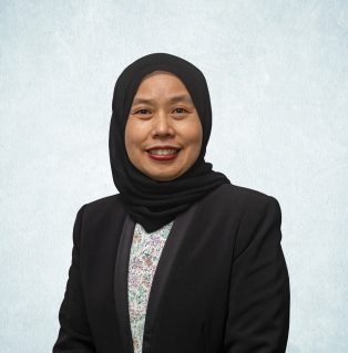 Image of Yang Mulia Hajah Sharidatul Maryani Binti Hj Saidin wearing a black jacket and headscarf.